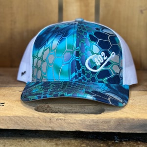 May include: A white and blue camouflage trucker hat with a white embroidered logo that says "402" with a fishing hook.