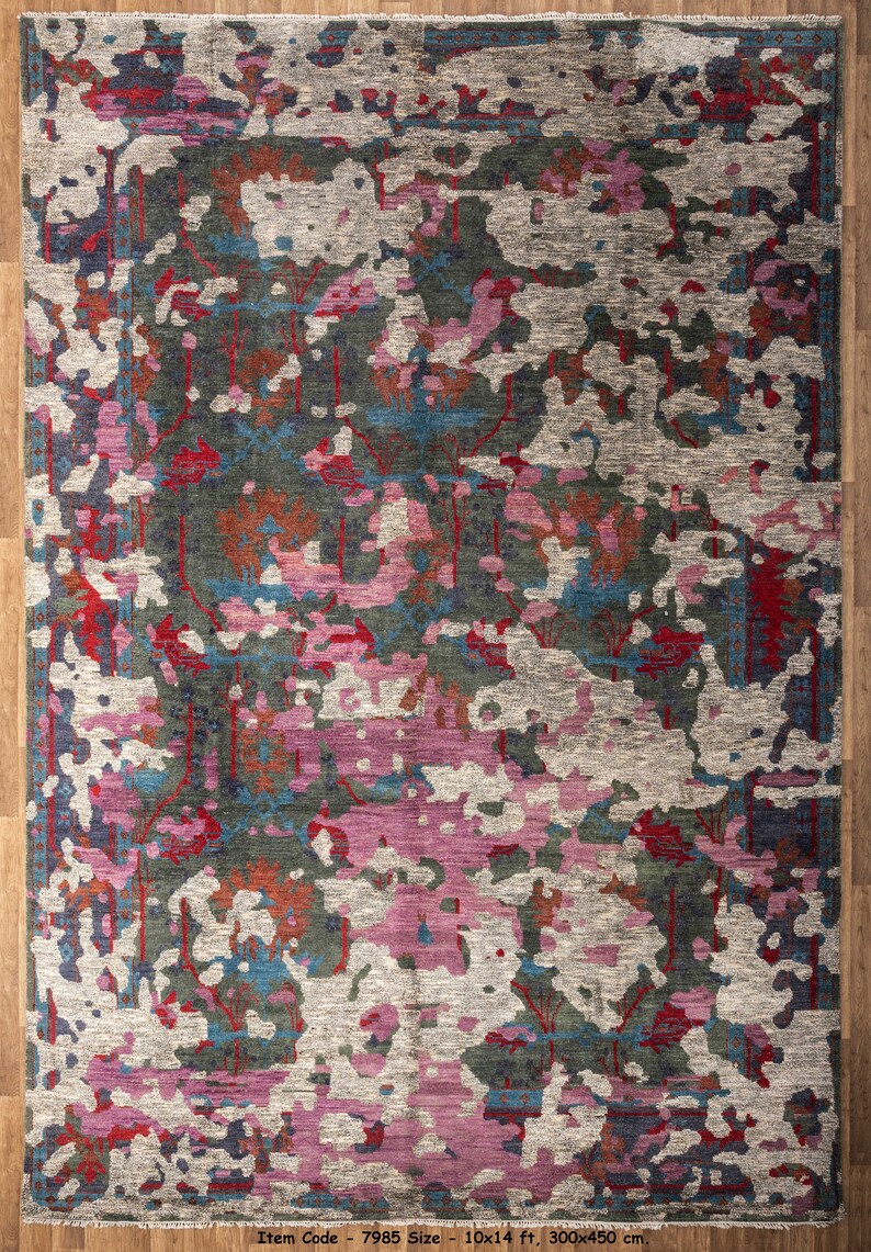 May include: Abstract area rug with a colorful design featuring shades of pink, blue, red, and green. The rug has a distressed look and a subtle pattern. Item Code - 7985 Size - 10x14 ft, 300x450 cm.