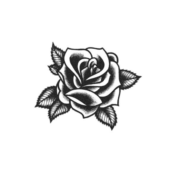 Blackworkillustrative rose tattoo on the upper back