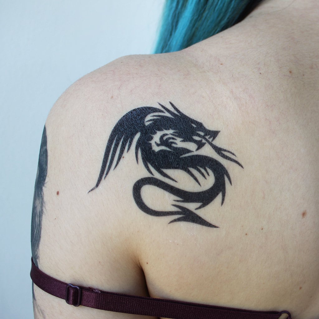 Shoulder tribal dragon tattoo