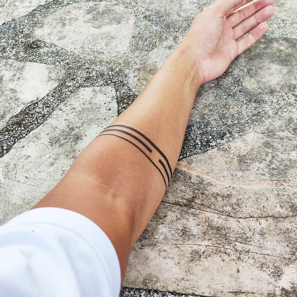 Male arm band tattoo with the word 'blest' on Craiyon