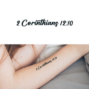 May include: A close-up of a person's arm with a temporary tattoo that reads "2 Corinthians 12:10".