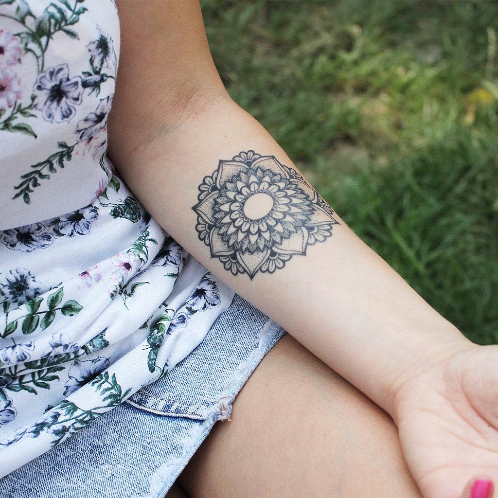 Pin by Nathan Louhenapessy on Mandala tattoo ideas | Wrist tattoos for  women, Cuff tattoo, Rihanna hand tattoo