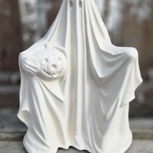 May include: A white ghost figurine holding a carved pumpkin. The ghost is draped in a flowing sheet with eye holes. The pumpkin has a carved face. The figurine is a Halloween decoration.