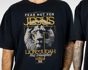 May include: Black t-shirt with a graphic of a lion's head and the text "Fear Not For Jesus Lion of Judah Has Triumphed Revelation 5:5".
