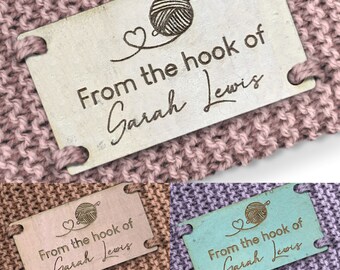 May include: A wooden tag with a heart and yarn ball design. The tag reads "From the hook of Sarah Lewis".