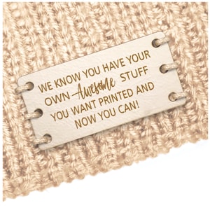 May include: A white leather tag with a gold inscription that reads "WE KNOW YOU HAVE YOUR OWN Awesome STUFF YOU WANT PRINTED AND NOW YOU CAN!"