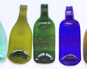 Melted up cycled wine bottle. Melted glass wine bottles. Flat plate melted glass bottle. Wine bottle cheese tray. Recycled glass plate.