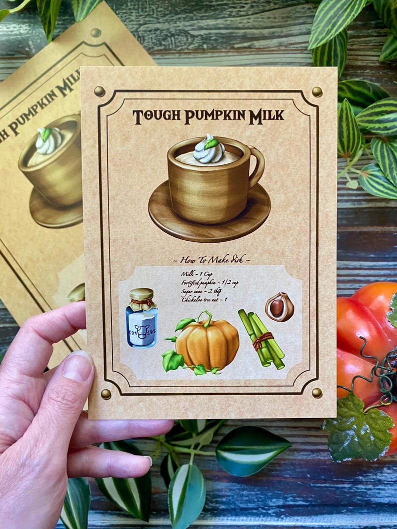 Op de afbeelding: Een vintage receptkaart voor "Tough Pumpkin Milk" met een gedetailleerde illustratie van een kopje van het drankje, ingredi&euml;nten en instructies. De kaart is bruin met decoratieve randen en tekst.