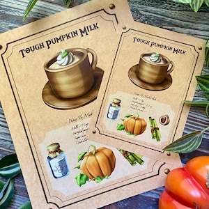 Op de afbeelding: Twee bruine papieren prints met de tekst "Tough Pumpkin Milk" en een tekening van een mok pompoenmelk. De prints bevatten ook illustraties van een pompoen, ingredi&euml;nten en een recept.