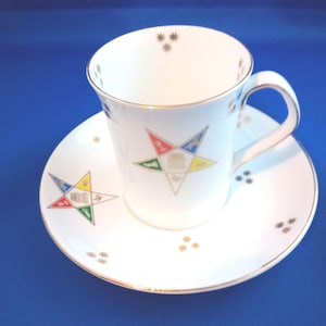 Taza de té y platillo de porcelana antigua de la Orden de la Estrella del Este, fabricados en Inglaterra.