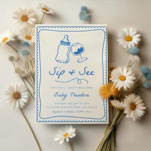 May include: A blue and white baby shower invitation with a bottle and wine glass illustration. The invitation reads "Sip & See" and "Join Olivia & Noah in welcoming Baby Theodore". The invitation also includes the date, time, and location of the shower.