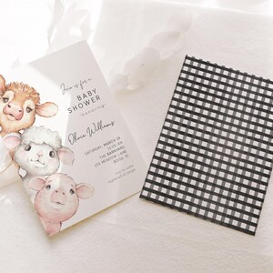 Op de afbeelding: Een baby shower uitnodiging met een aquarel illustratie van een koe, lam en varken. De uitnodiging is voor Ohvia Williams en is voor een baby shower in The Barnyard op zaterdag 19 maart om 11:00 uur. Het adres is 153 Meadow Lane, Boise, ID.