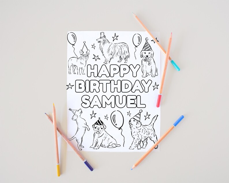 May include: A black and white line drawing of several dogs wearing party hats and holding balloons. The words "HAPPY BIRTHDAY SAMUEL" are written in the center of the image. Several colored pencils are scattered around the drawing.