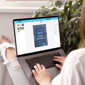 May include: A laptop displaying a baby shower invitation design with the text "Taylor's BABY SHOWER." The screen also shows the text "DEMO BEFORE YOU BUY BY USING DEMO LINK IN LISTING DESCRIPTION."