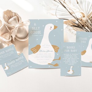 May include: A blue and white baby shower invitation with a cartoon goose and the text "A Silly Goose is almost here!"  The invitation also includes a diaper raffle ticket and a book request card.