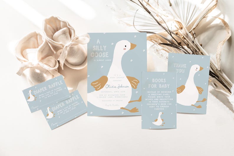 May include: A blue and white baby shower invitation with a cartoon goose and the text "A Silly Goose is almost here!"  The invitation also includes a diaper raffle ticket and a book request card.