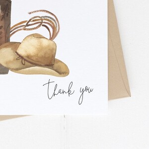 May include: A watercolor illustration of a cowboy hat and boots with the text "thank you" written below.