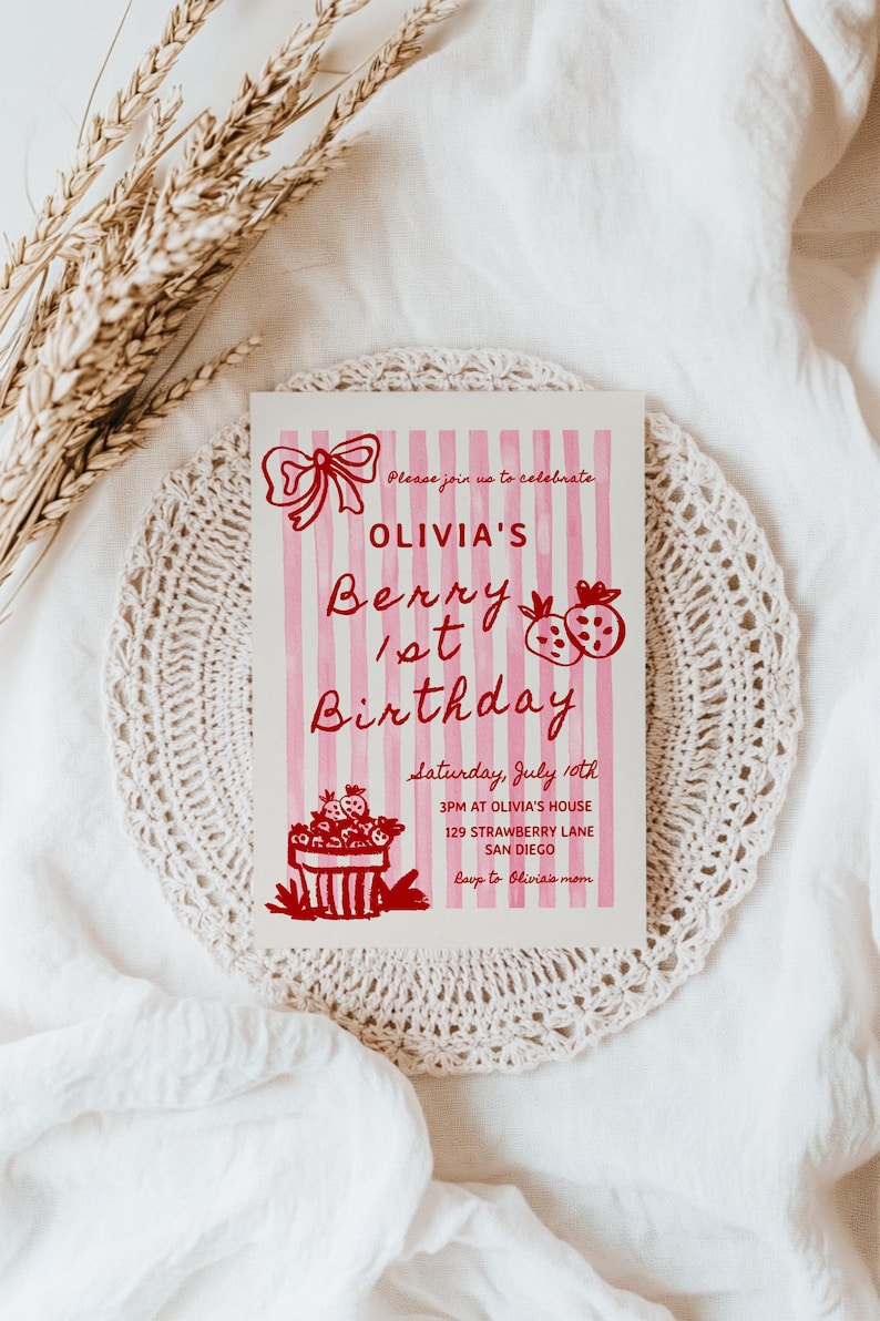 May include: Pink and white striped birthday invitation with red text that says "Olivia's Berry 1st Birthday". The invitation includes details for the party, including the date, time, and location.