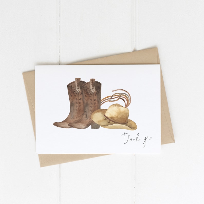 May include: A white card with a watercolor illustration of brown cowboy boots and a brown cowboy hat. The text "Thank you" is written in black cursive on the card.