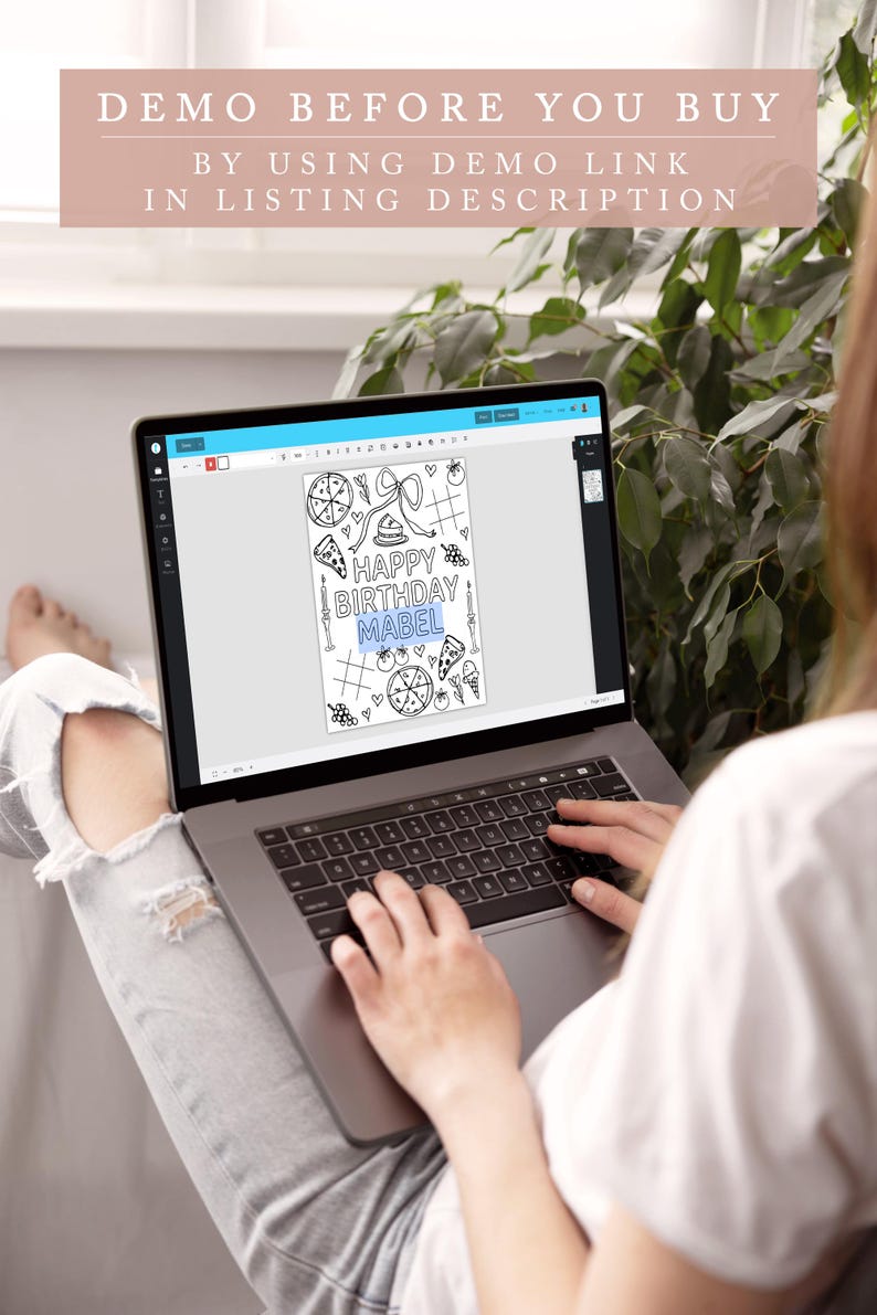 May include: A laptop displaying a black and white birthday card design with the text "HAPPY BIRTHDAY MABEL". The laptop screen also shows the text "DEMO BEFORE YOU BUY BY USING DEMO LINK IN LISTING DESCRIPTION". The person is wearing a white shirt and ripped jeans.