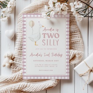 May include: A pink and white gingham patterned invitation with a cartoon goose illustration. The text reads "Amelia is Two Silly" and includes details for a 2nd birthday party.