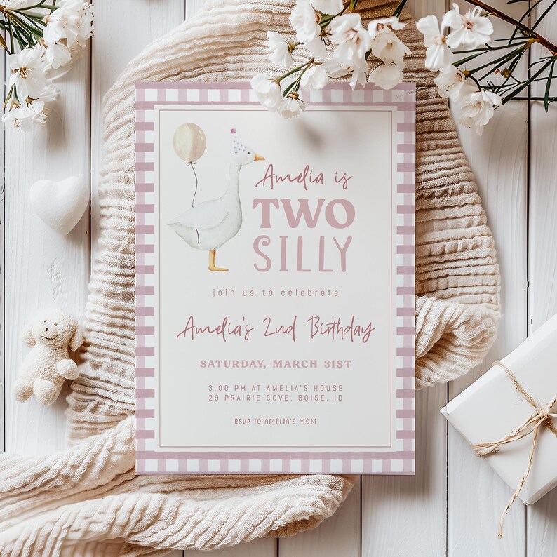 May include: A pink and white gingham patterned invitation with a cartoon goose illustration. The text reads "Amelia is Two Silly" and includes details for a 2nd birthday party.