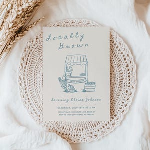 May include: A baby shower invitation with a hand-drawn illustration of a market stand with the text "Locally Grown" and "Baby Shower". The invitation is for Eloise Johnson and includes the date, time, and location of the event.