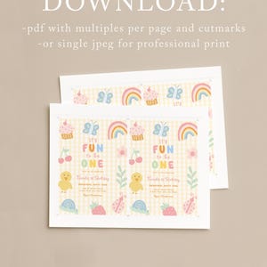 May include: Two white cards with a colorful design for a first birthday party. The design includes rainbows, cupcakes, butterflies, and the text "It's Fun to be One". The cards have a yellow checkered background.