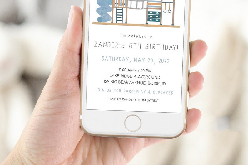May include: A digital invitation for a 5th birthday party. The invitation features a cartoon illustration of a playground with a blue and brown color scheme. The text on the invitation reads "to celebrate ZANDER'S 5TH BIRTHDAY! SATURDAY, MAY 28, 2022 11:00 AM - 2:00 PM LAKE RIDGE PLAYGROUND 129 BIG BEAR AVENUE, BOISE, ID JOIN US FOR PARK PLAY & CUPCAKES RSVP TO ZANDER'S MOM BY TEXT"