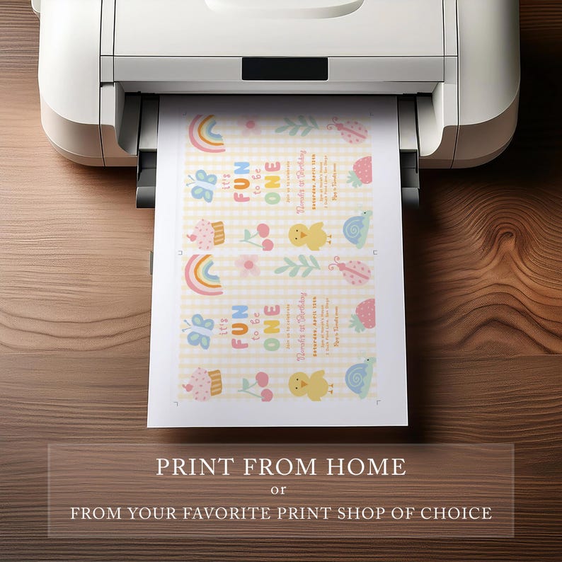 May include: A printer printing a sheet of paper with a colorful birthday design. The design includes rainbows, cupcakes, cherries, chicks, and snails. The text on the paper says "It's Fun to be One". The bottom of the image has the text "Print from Home or From Your Favorite Print Shop of Choice."