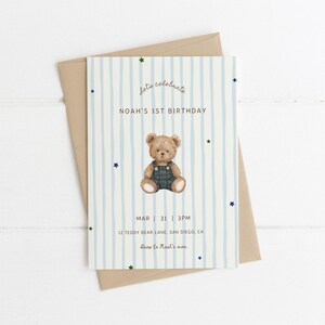 May include: A birthday invitation featuring a teddy bear illustration in denim dungarees. The card has a blue and white striped design with the text "Let's celebrate, Noah's 1st Birthday". Includes date, time, and address details.