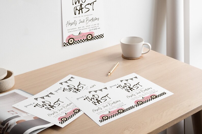 May include: Four white cards with black text that reads "Two Fast" and a pink race car graphic. The text also says "Hazel's 2nd Birthday".