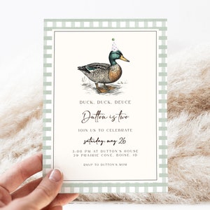 May include: A green and white checkered invitation card with a cartoon duck wearing a party hat. The text on the card reads "Duck, Duck, Deuce Dutton is two. Join us to celebrate Saturday, May 26. 3:00 PM at Dutton's House 29 Prairie Cove, Boise, ID. RSVP to Dutton's Mom."