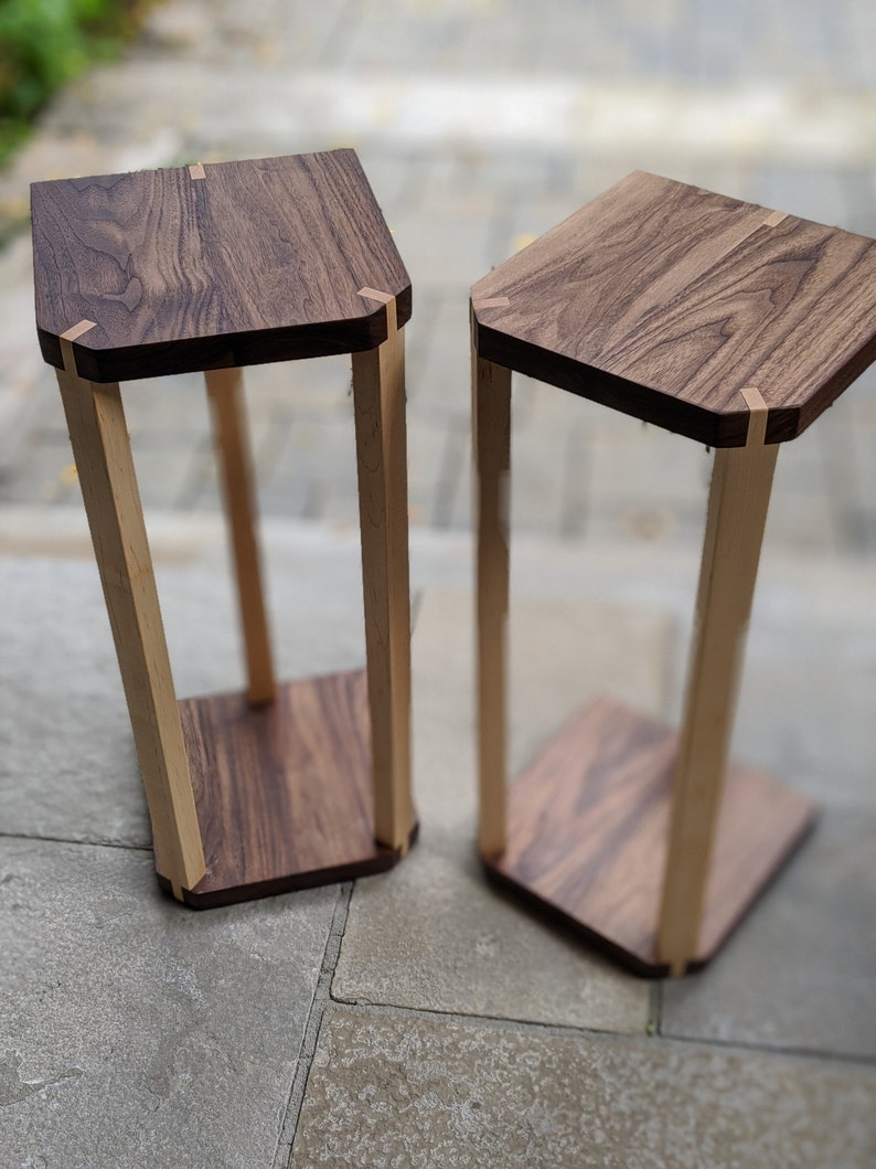 A pair of audio speaker stands 2.0 Walnut top with maple legs image 1