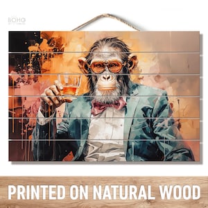 May include: A rectangular wooden wall hanging featuring a printed illustration of a chimpanzee wearing a teal suit, a white shirt, a maroon bow tie, and orange-tinted glasses. The chimpanzee holds a glass of amber liquid against an abstract background.