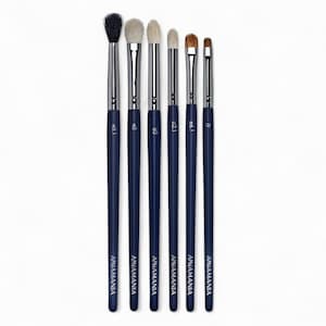 May include: Set of six blue makeup brushes with silver ferrules and white bristles. The brushes are labeled with numbers and the brand name "ANAMANIA".