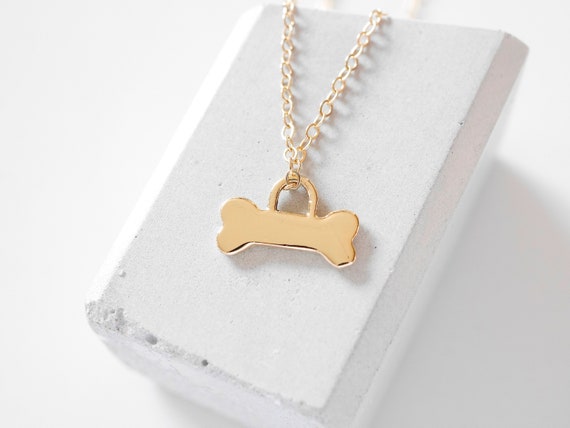 Gold dog bone best sale necklace