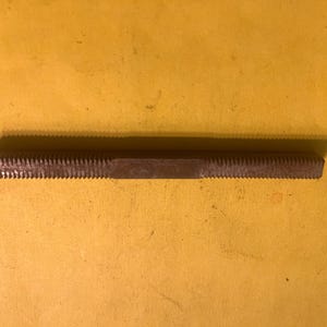 May include: A set of three ceramic mugs with a speckled, matte finish. The mugs are in shades of cream, light gray, and dark gray. Each mug has a simple, minimalist design and a rounded handle. Perfect for coffee or tea.