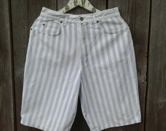 May include: White and light blue striped denim shorts with a high waist.