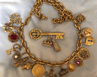 Vintage 1980 French Etruscan Couture matte Gold toned Multi Charm Necklace and Brooch