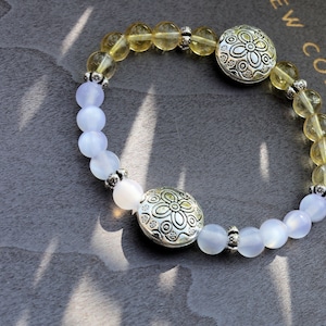 Intrinsic Natural Top Grade White Moonstone Cat Eye Selenite with the Citrine stone.  bright and happy energy fills your spirit