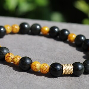 Beautiful Marble-look Glass beads with Obsidian beads. helping to shield against negative energies and promoting grounding and balance