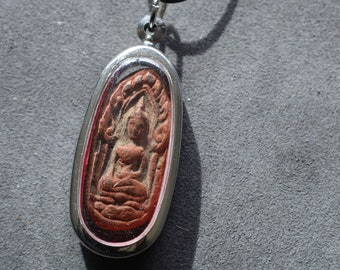 The Phra Khun Phaen (Split Egg) amulet created by Luang Por Dee of Wat Phra Rup in Suphanburi is a unique and highly revered artifact