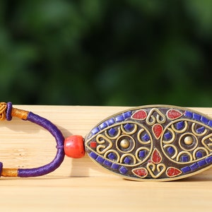 Oval with Teardrop, pendant with Hand Knotted Adjustable Cord String Necklace. Handmade Indonesian beads are exquisite and diverse