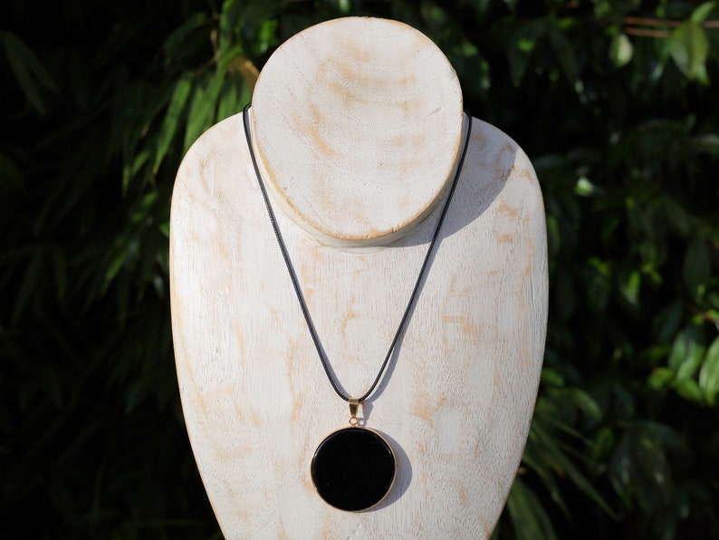 Black mirror Obsidian Natural Stone Disc Shape Pendant.Obsidian Natural Stone Disc Shape Pendant, often referred to as a black mirror image 3