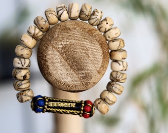 Viśēśa Jewel Collection - Special Mala beaded bracelet with Mani Mantra (Om mani padme hum) writings. Under which the Buddha sat.