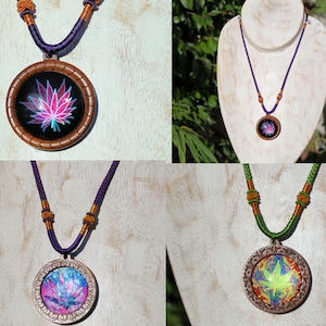 May include: Four necklaces with round pendants featuring colorful, psychedelic marijuana leaf designs. The pendants are made of wood and have a dark brown finish. The necklaces are made of purple and green cord with brown accents.
