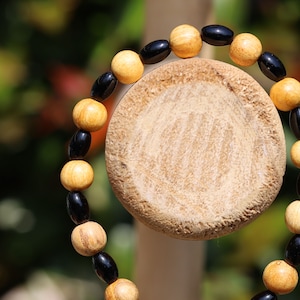 Unique Palo Santo Wood bracelet combined with Natural Black Agate Barrel Beads. Perfect handmade gifts and on-trend unique jewelry.