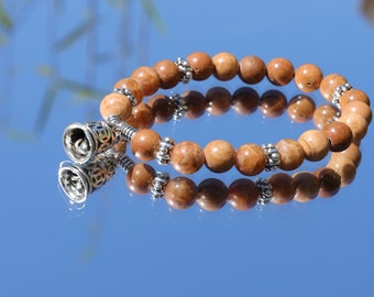 Remarkable Tigerskin Jasper Beaded bracelet with Buddhist Prayer Bell.  Promotes well being and is said to strengthen our emotional bodies